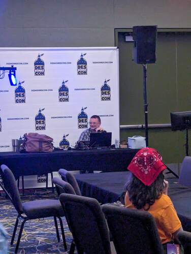 Brian running karaoke at Des Moines Con