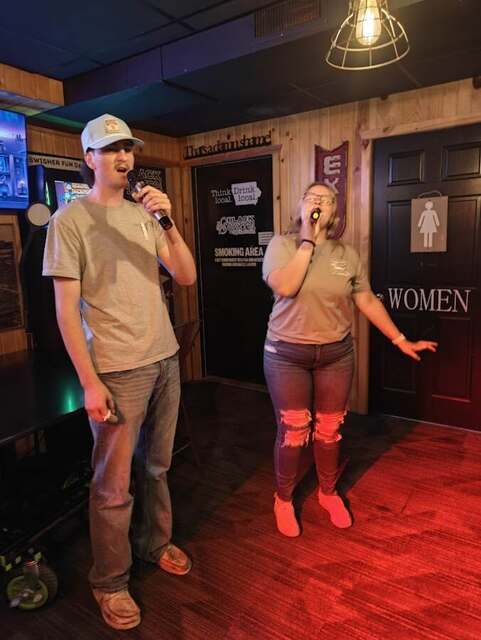 Guests singing karaoke together